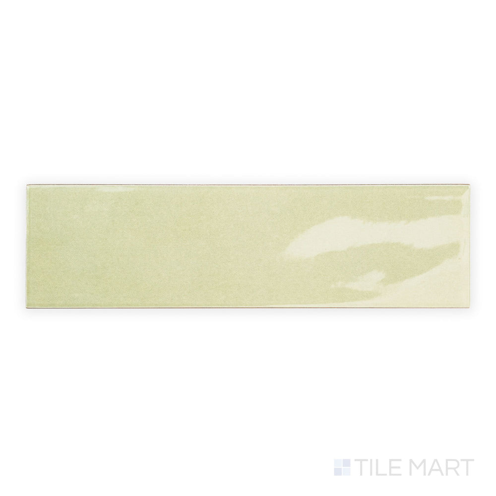 Top-down view of Canvas Green Tea 3x10 Glossy Ceramic Tile highlighting its soft green hue and glassy surface for a refreshing wall finish.