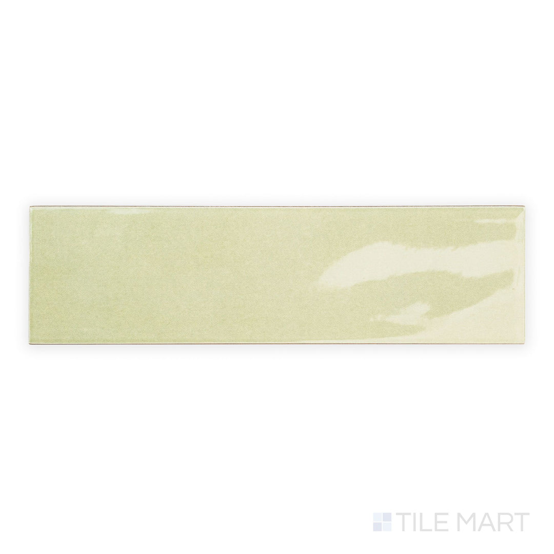 Top-down view of Canvas Green Tea 3x10 Glossy Ceramic Tile highlighting its soft green hue and glassy surface for a refreshing wall finish.