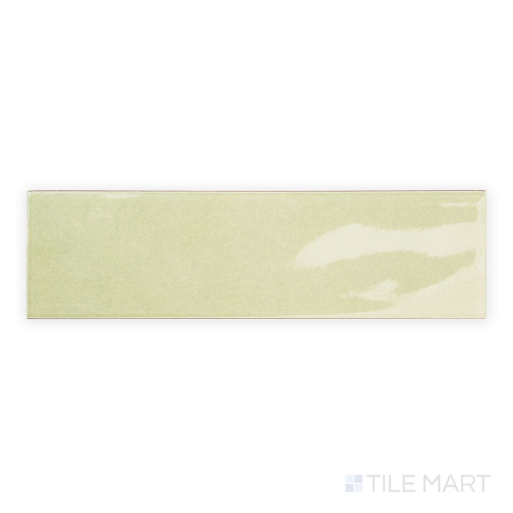 Top-down view of Canvas Green Tea 3x10 Glossy Ceramic Tile highlighting its soft green hue and glassy surface for a refreshing wall finish.