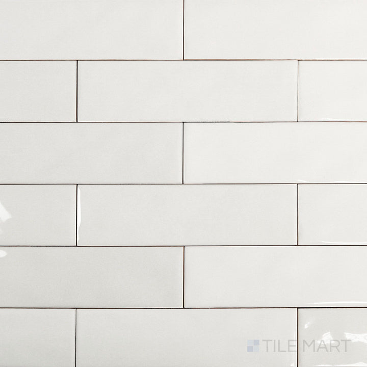 Canvas Yuki White 3x10 Glossy Ceramic Tile in an overview view, presenting its crisp white tone and shiny surface in a slender tile format.
