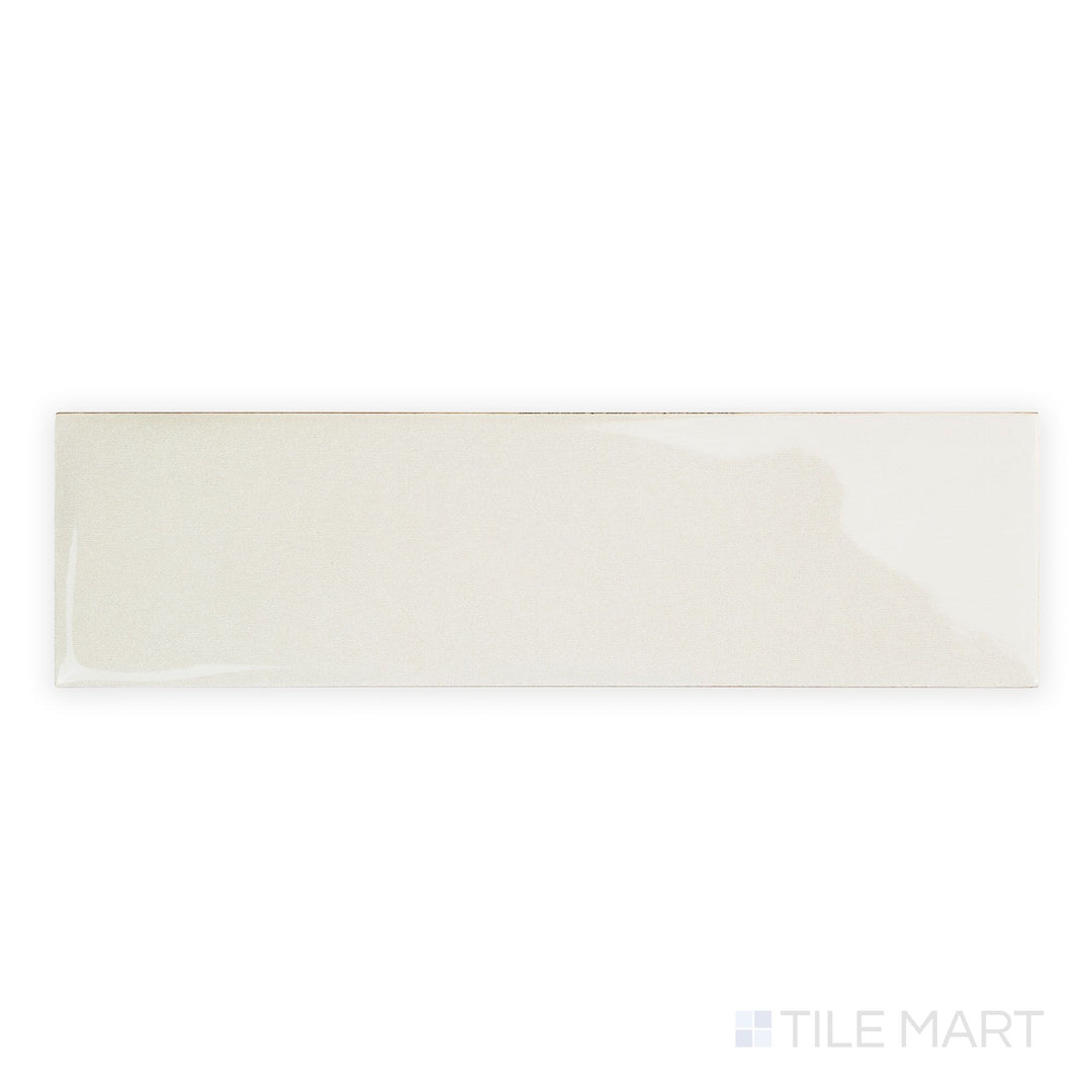 Canvas Yuki White 3x10 Glossy Ceramic Tile in a top-down perspective, showcasing its pure white glaze and reflective ceramic body in a narrow profile.