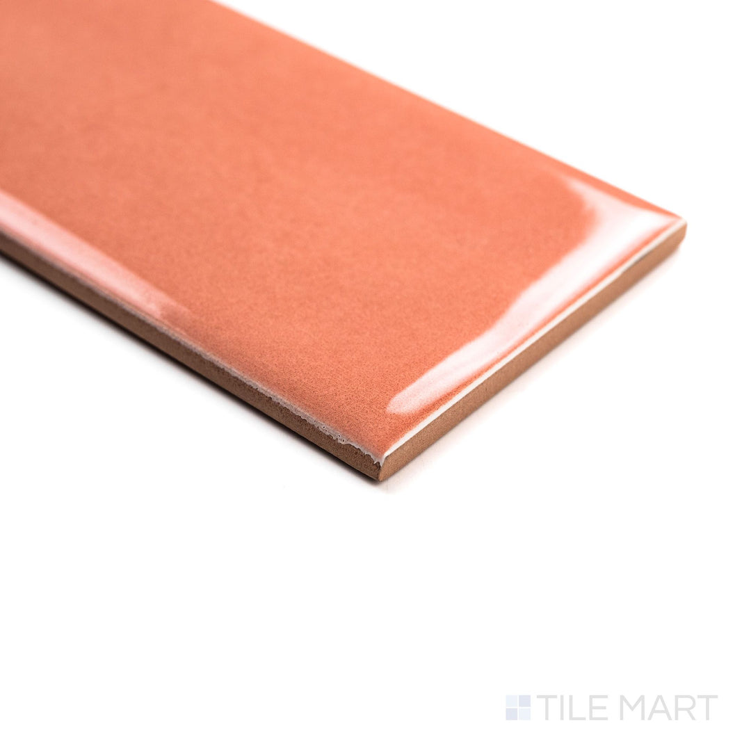 Angled image of Canvas Hana Bloom 3x10 Glossy Ceramic Tile showing its soft blush hue and polished glossy surface from a side perspective.