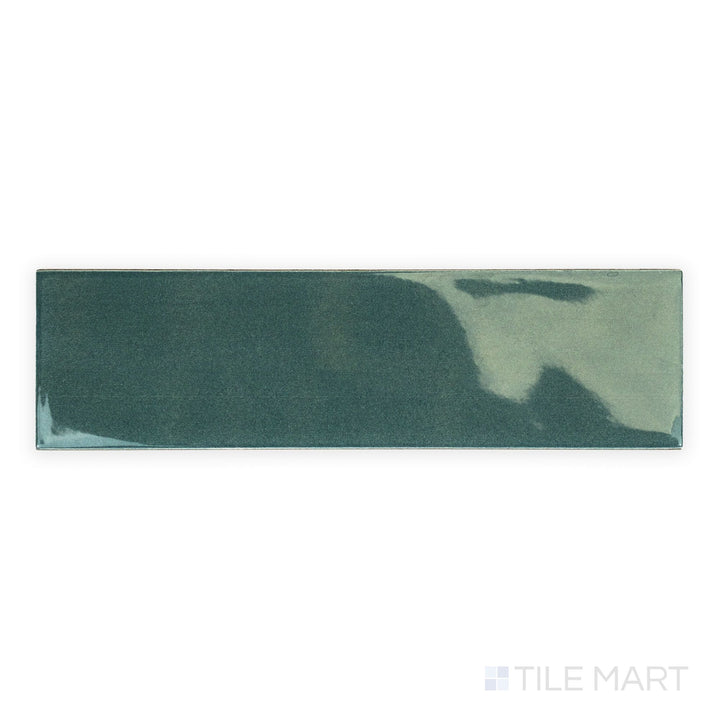 Canvas Midnight Jade 3x10 Glossy Ceramic Tile seen from above, displaying its rich deep green tone and glossy surface in a modern elongated layout.
