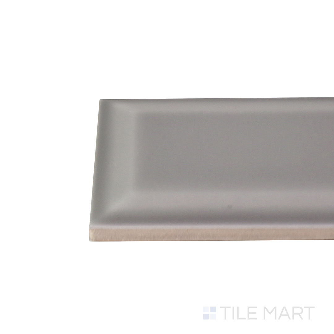 Corner shot of the beige and tan ceramic tile from the Boutique Sleek series, highlighting its material composition and slim profile.