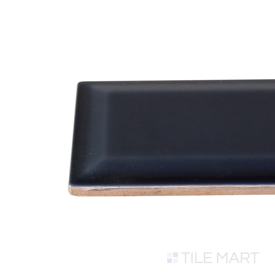 A detailed corner view of the indigo blue tile, showcasing its thickness and robust ceramic construction.