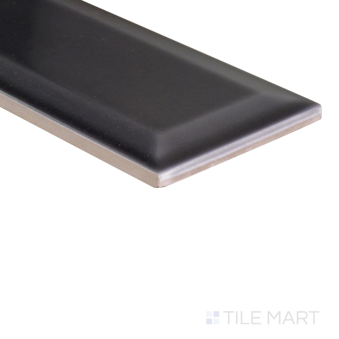 A dynamic angle capturing the dark gray and black tile from the Boutique Sleek series, showcasing its polished surface and modern appeal.