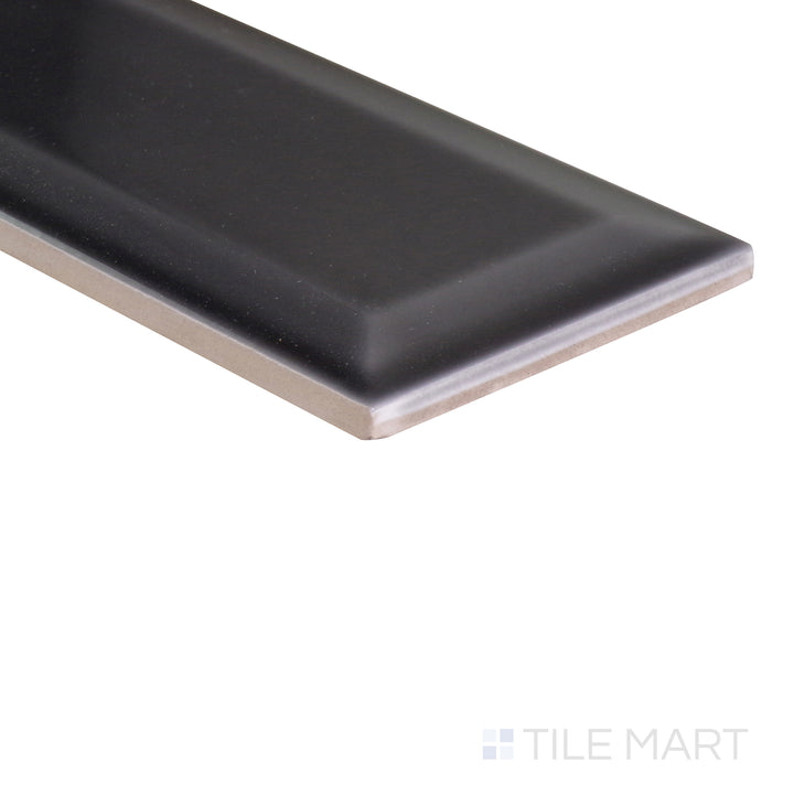 A dynamic angle capturing the dark gray and black tile from the Boutique Sleek series, showcasing its polished surface and modern appeal.