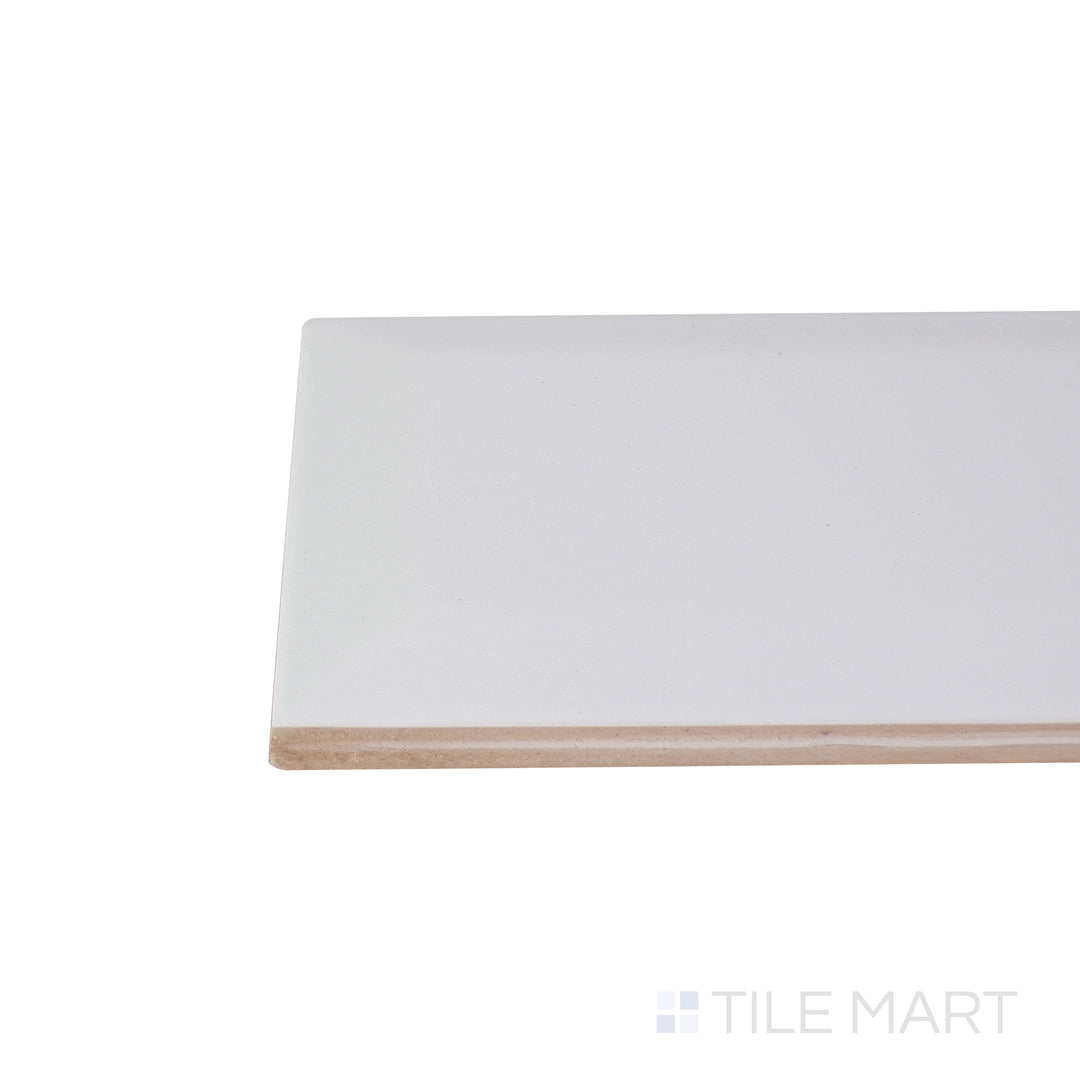 Close-up corner shot of the glossy white tile, showing its ceramic build and sleek edges.