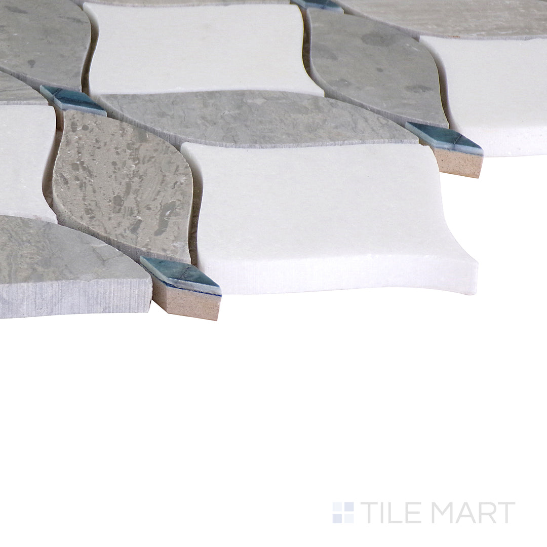 An angled shot of the tan and beige tile, revealing its polished surface and natural color variation.