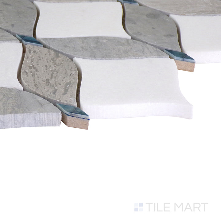 An angled shot of the tan and beige tile, revealing its polished surface and natural color variation.