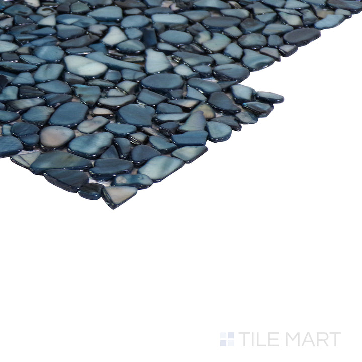 An angled view of the indigo blue tile from the Boutique Sleek series, emphasizing its glossy finish and bold color.