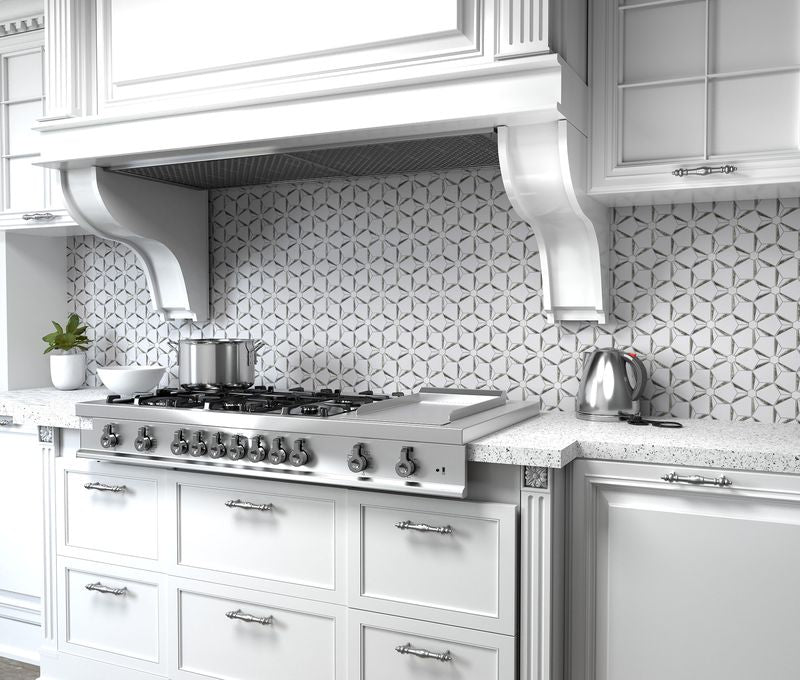 Shimmering silver tones and an intricate pattern define Dazzle Silver Kaleidoscope polished mosaic, adding a dazzling touch.