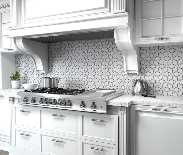 Shimmering silver tones and an intricate pattern define Dazzle Silver Kaleidoscope polished mosaic, adding a dazzling touch.