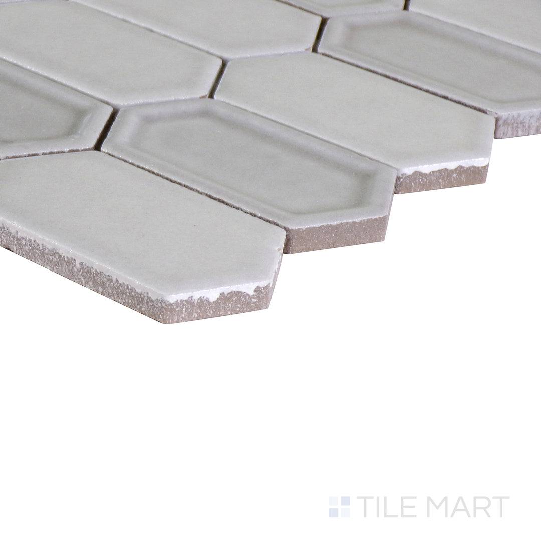 An angled shot of the tan and beige tile, revealing its polished surface and natural color variation.