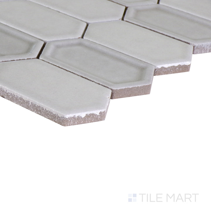 An angled shot of the tan and beige tile, revealing its polished surface and natural color variation.