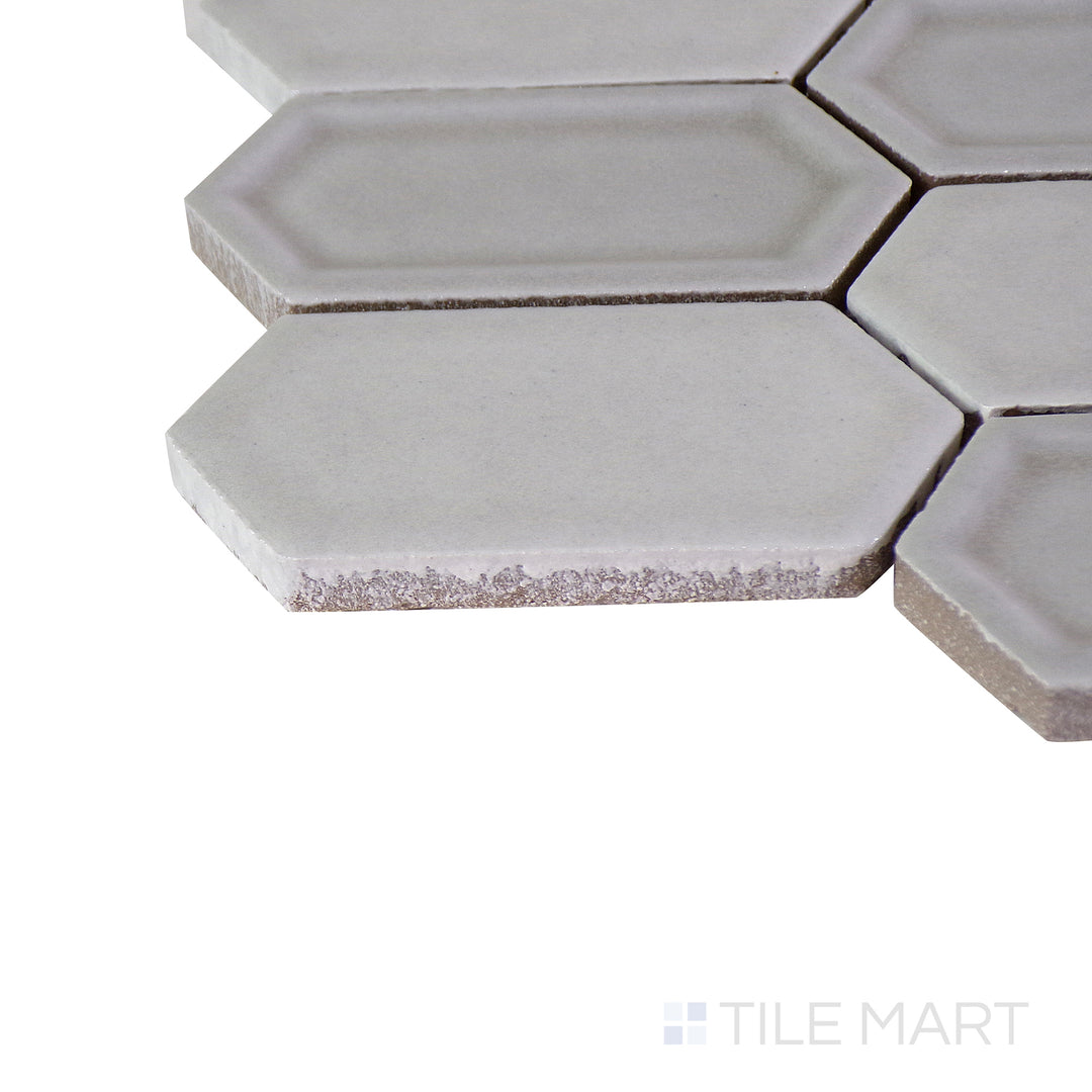 Corner shot of the tan and beige tile, emphasizing its thickness and high-quality ceramic material.