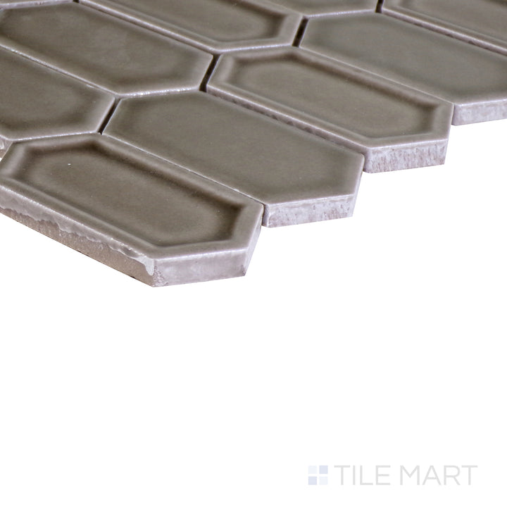 The indigo blue tile from the Boutique Sleek series, captured from an angle to emphasize its striking color and matte finish.