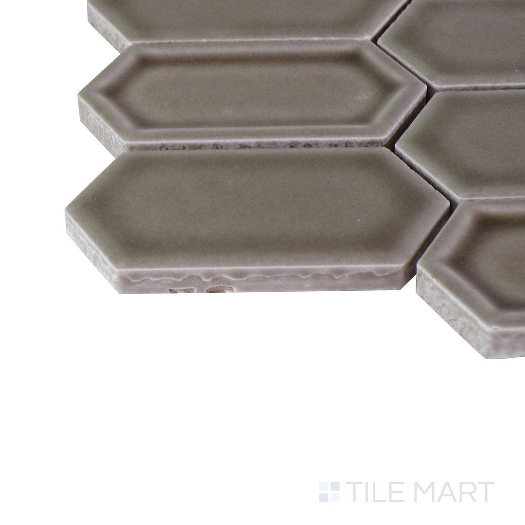 A detailed corner view of the indigo blue tile, revealing its solid construction and substantial thickness.