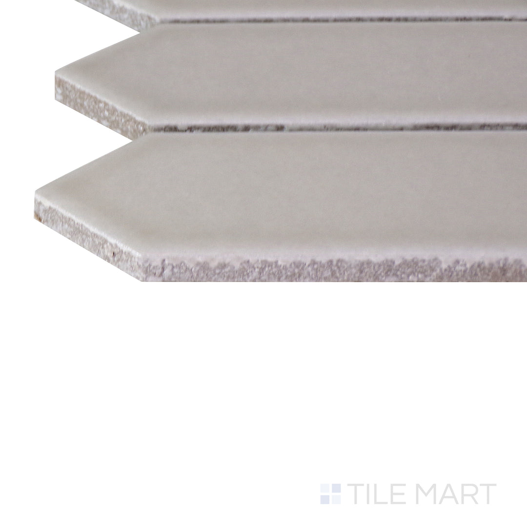 A close-up of the matte white tile's corner, showing its refined edges and robust material thickness.