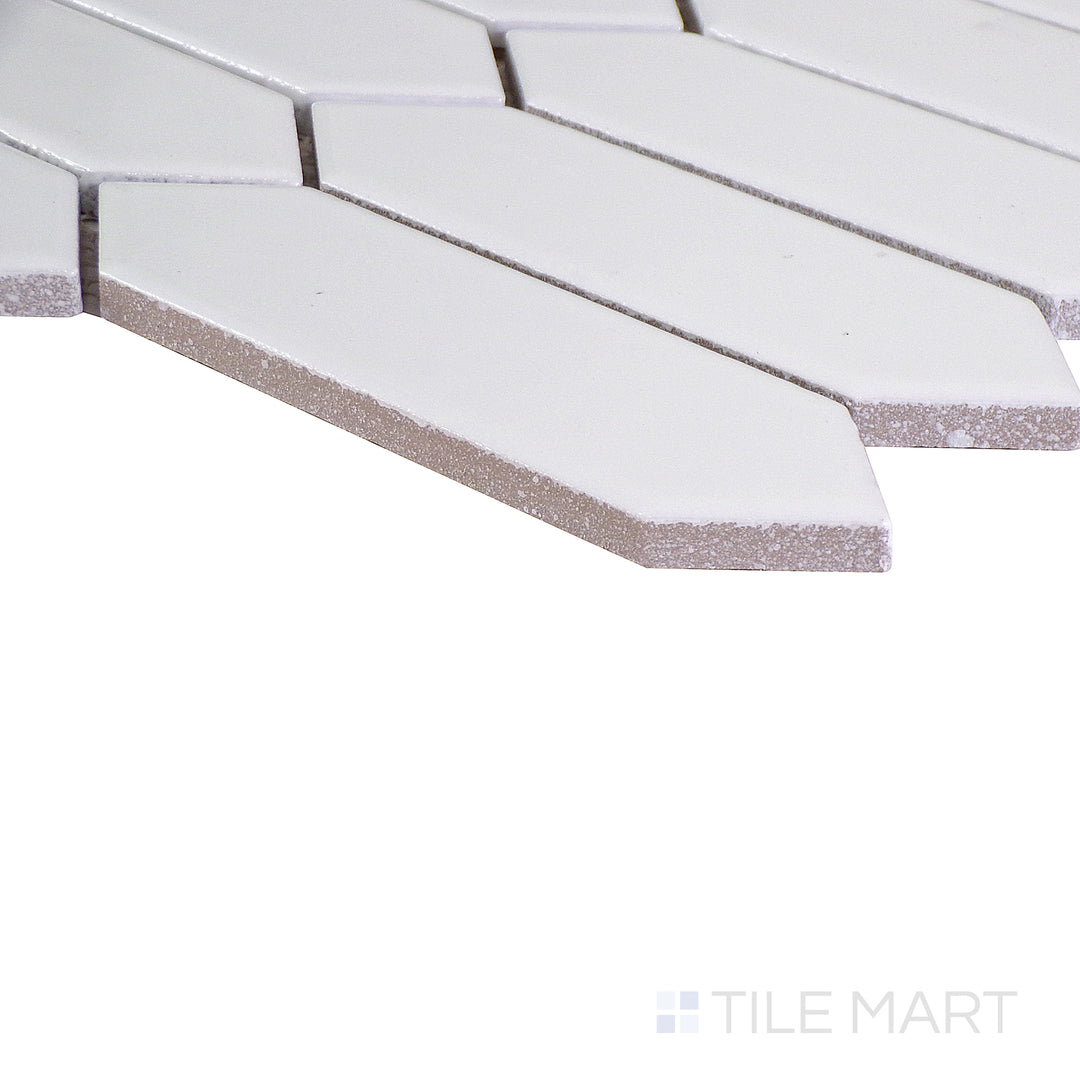 Angled shot showcasing the beige and tan ceramic tile from the Boutique Sleek series, highlighting its smooth surface and refined texture.