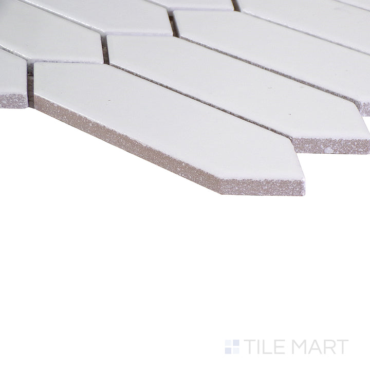 Angled shot showcasing the beige and tan ceramic tile from the Boutique Sleek series, highlighting its smooth surface and refined texture.