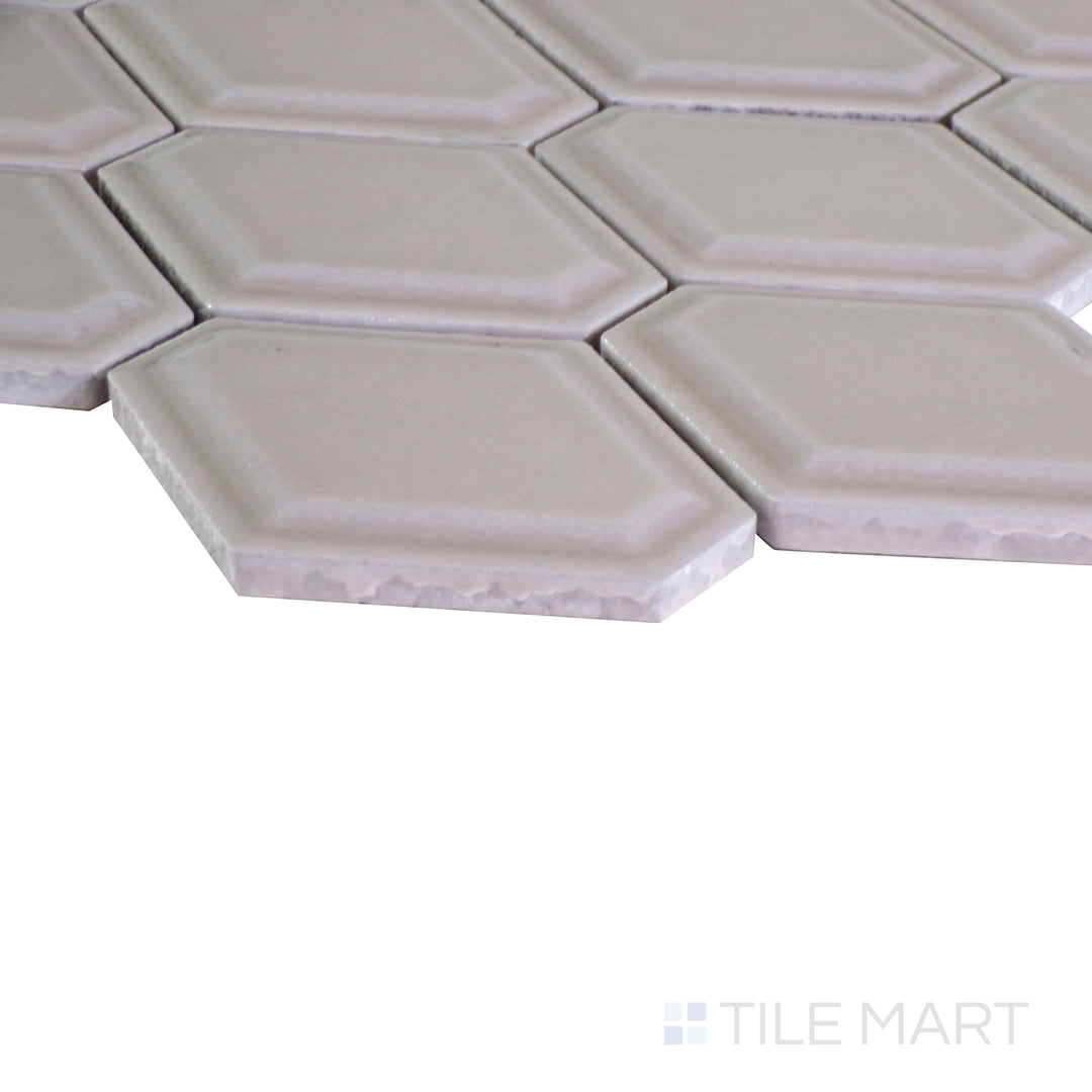 An angled view of the indigo blue tile from the Boutique Sleek series, emphasizing its glossy finish and bold color.