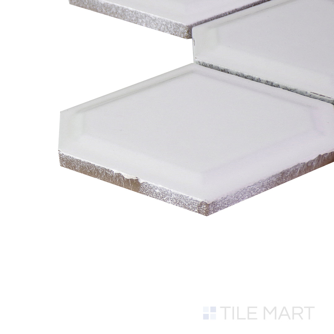 Close-up corner shot of the glossy white tile, showing its ceramic build and sleek edges.