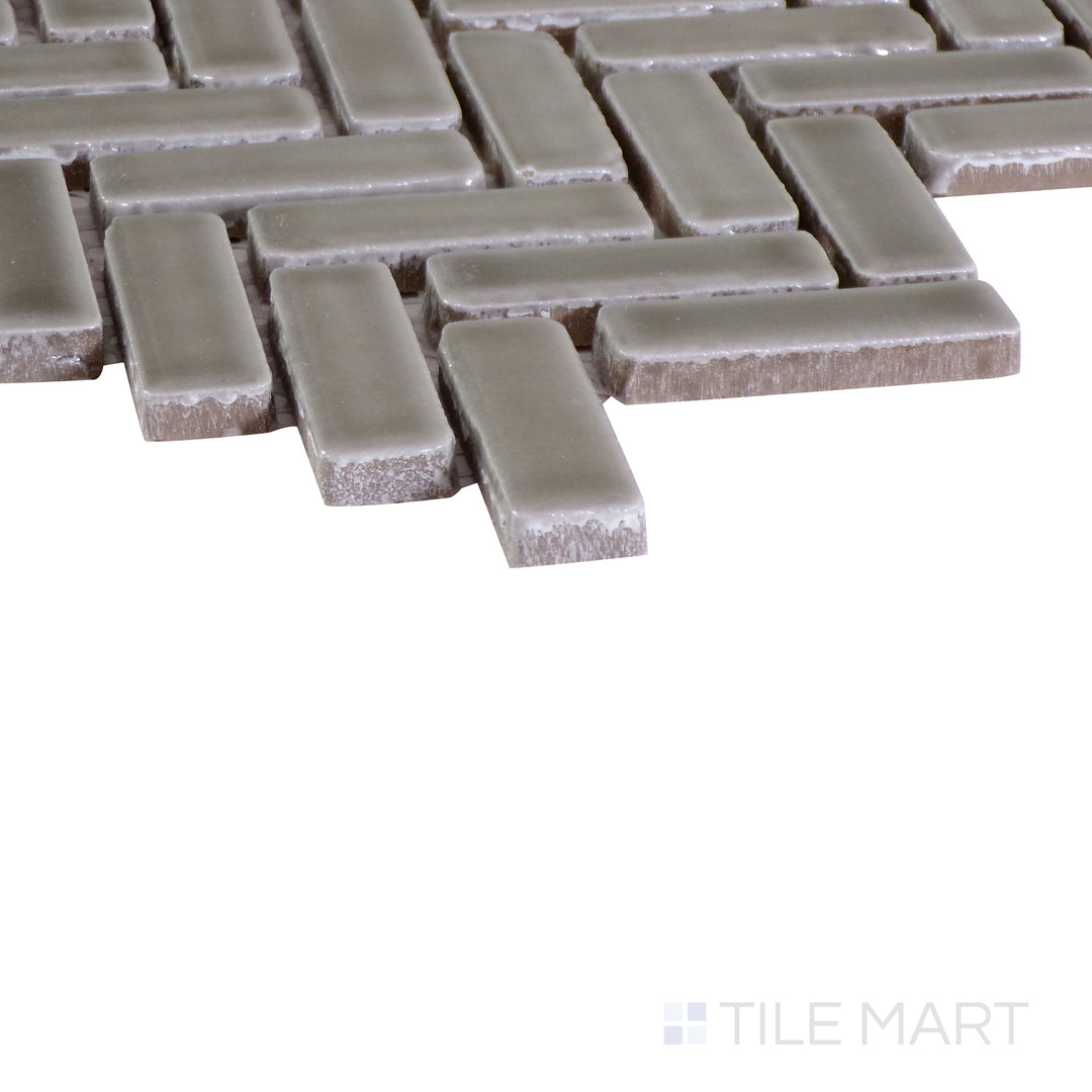 An angled shot of the tan and beige tile, revealing its polished surface and natural color variation.