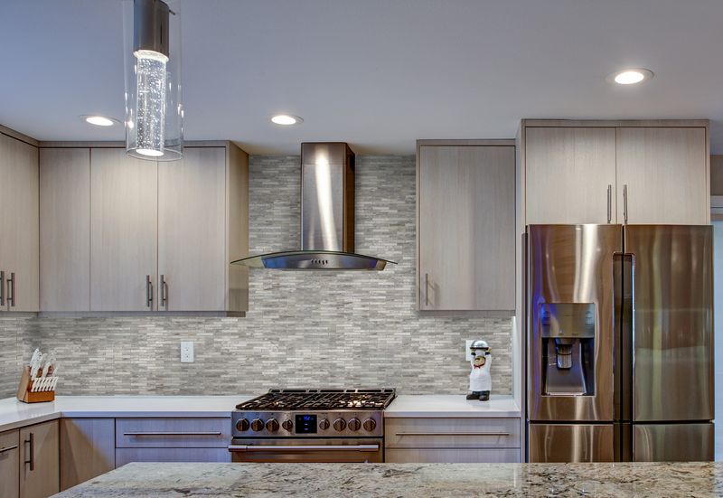 Soft, matte white tiles provide a peaceful and understated backdrop, enhancing the serene ambiance of the room.