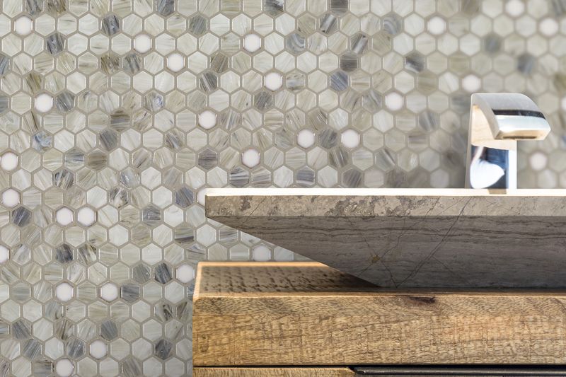 A cozy space enhanced by the beige and tan ceramic tile from the Boutique Sleek series, adding warmth and comfort.