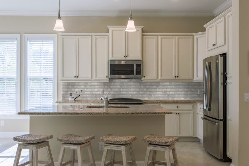 The dark gray and black tile from the Boutique Sleek series adds sophistication and depth to this contemporary space.