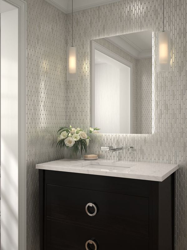 Soft, matte white tiles provide a peaceful and understated backdrop, enhancing the serene ambiance of the room.