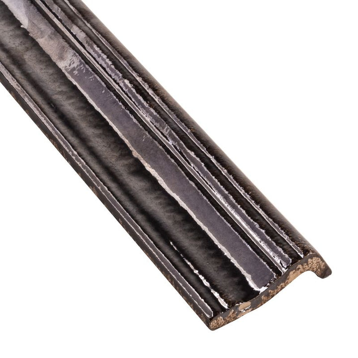 A close-up corner shot of Moroccan Habitat Blazen 2x12 glossy ceramic chair rail, highlighting its smooth curved edge and polished finish.