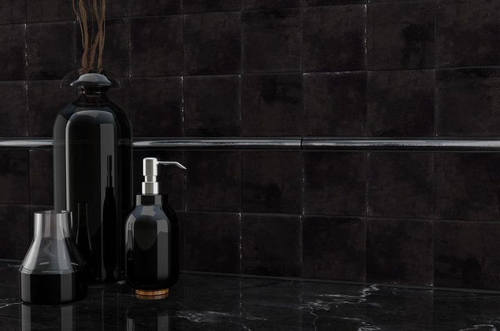 A modern room with indigo blue tiles from the Boutique Sleek series, creating a bold statement against minimalist decor.