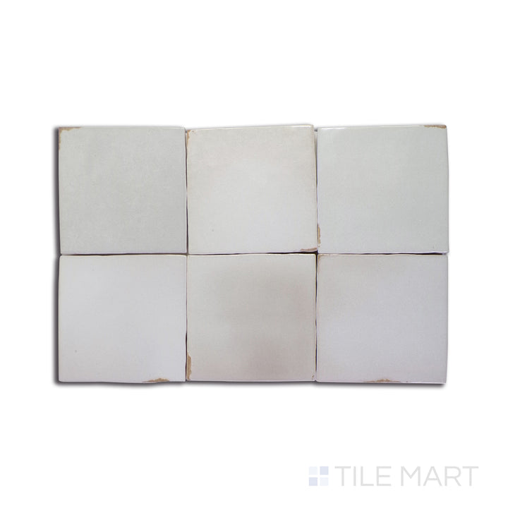 A dark gray and black ceramic tile, featuring a glossy surface that enhances depth and texture in contemporary spaces.