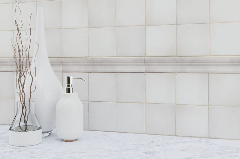 An elegant space with glossy white tiles from the Salt Glossy series, reflecting natural light beautifully.