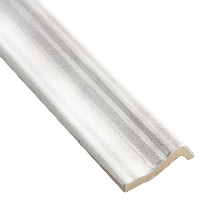 A corner view of Moroccan Habitat Canvas 2x12 glossy ceramic chair rail, emphasizing its sculpted edge and high-gloss surface.