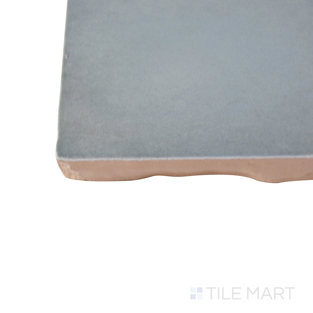 Corner shot of the tan and beige tile, emphasizing its thickness and high-quality ceramic material.