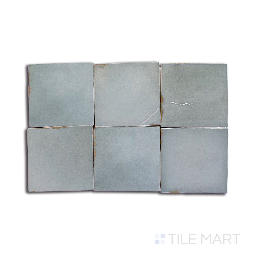 A tan and beige ceramic tile with a sleek, polished finish, perfect for warm and inviting living spaces.