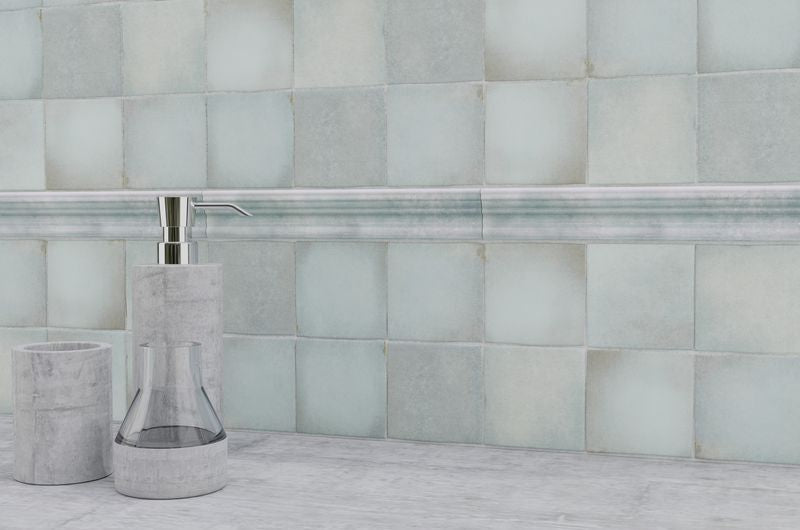 Striking indigo blue tiles from the Boutique Sleek series add contrast and character to this sleek, contemporary room.