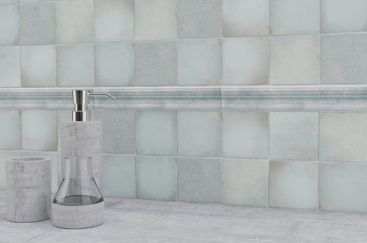 Striking indigo blue tiles from the Boutique Sleek series add contrast and character to this sleek, contemporary room.