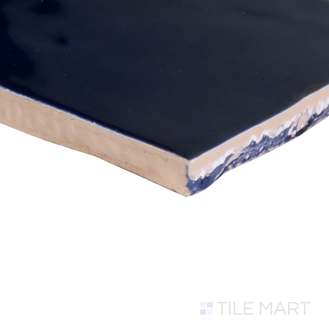 Angled shot showcasing the beige and tan ceramic tile from the Boutique Sleek series, highlighting its smooth surface and refined texture.