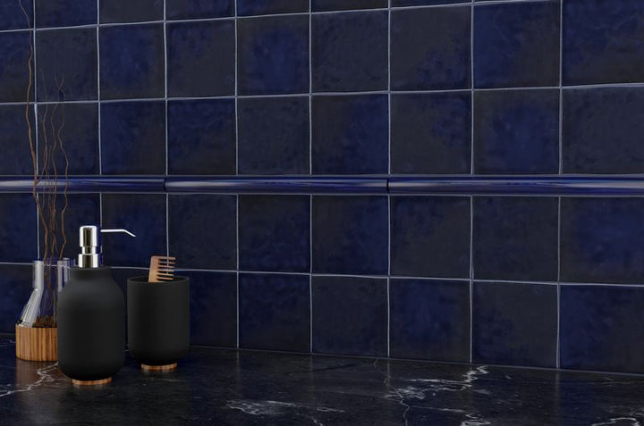 The dark gray and black tile from the Boutique Sleek series adds sophistication and depth to this contemporary space.