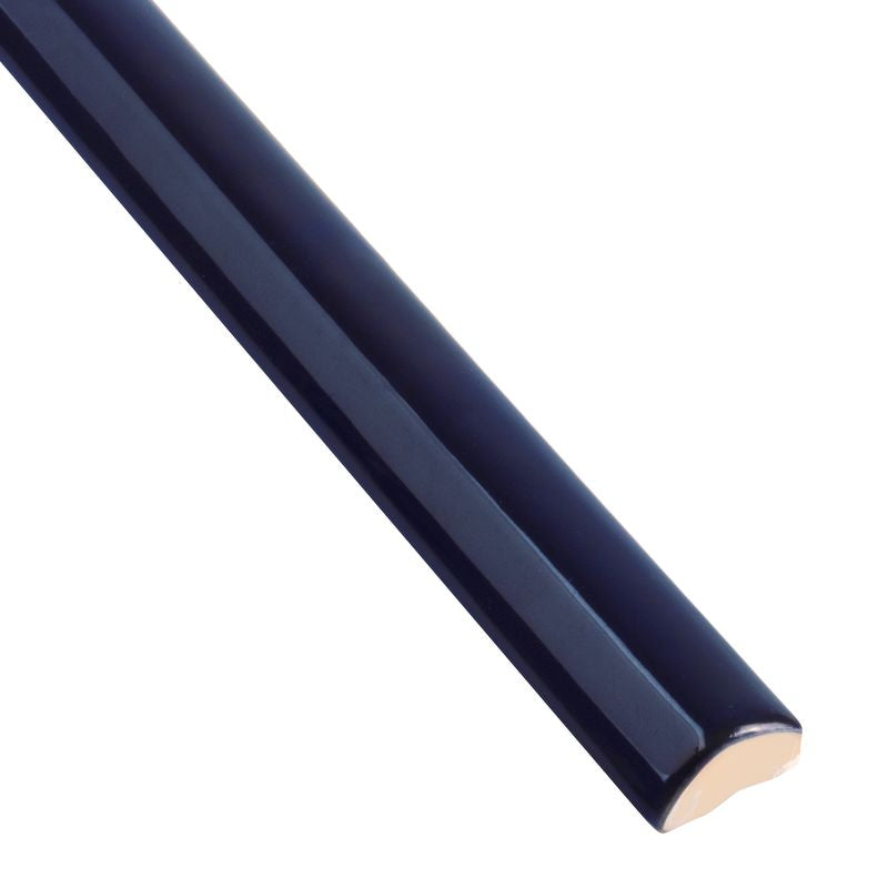 A detailed corner view of Moroccan Habitat Peacock 1x12 glossy ceramic pencil trim, capturing its vibrant hue and glossy finish.