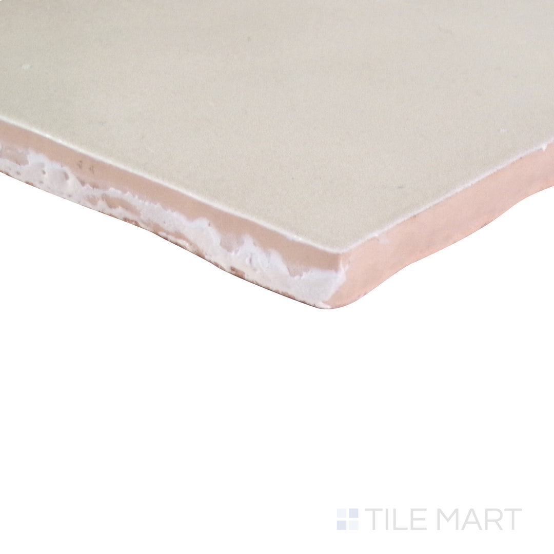 An angled perspective of the glossy white tile from the Salt Glossy series, reflecting light to enhance its sleek appearance.