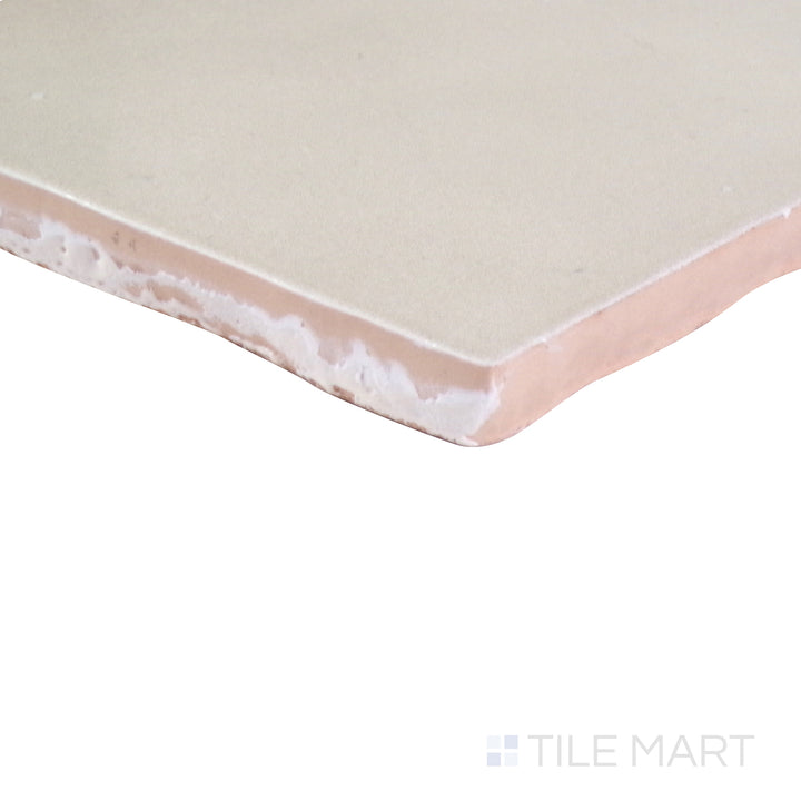 An angled perspective of the glossy white tile from the Salt Glossy series, reflecting light to enhance its sleek appearance.