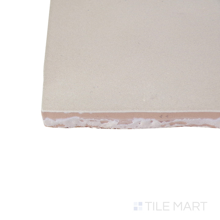 Close-up corner shot of the glossy white tile, showing its ceramic build and sleek edges.