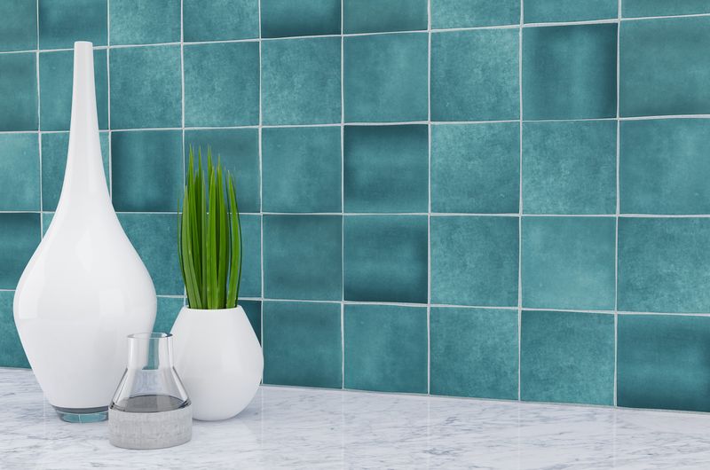 Striking indigo blue tiles from the Boutique Sleek series add contrast and character to this sleek, contemporary room.