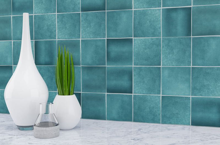 Striking indigo blue tiles from the Boutique Sleek series add contrast and character to this sleek, contemporary room.