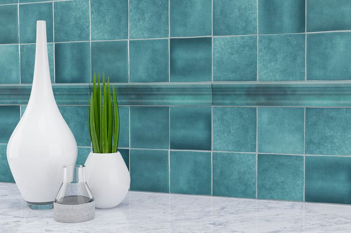 The dark, polished gray tiles bring a sense of sophistication and modernity to this refined space.